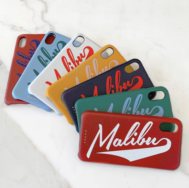 Chaos iphone case in red, blue, white, yellow, black and green. They all have the world malibu written across it and the logo chaos on the bottom.