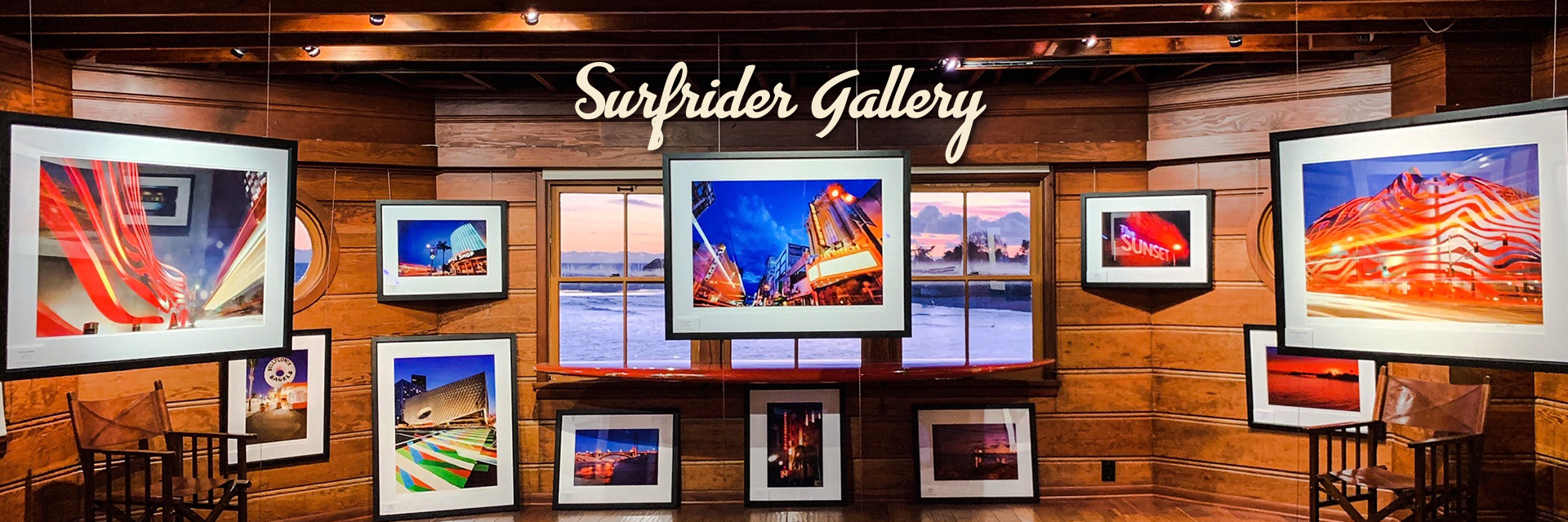 Surfrider Gallery | Multiple images hung on a wall made of wood