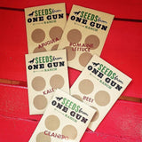Seeds from One Gun Ranch in a paper package. Arugula. romain Lettuce. Kale. Beet. Cilantro. 