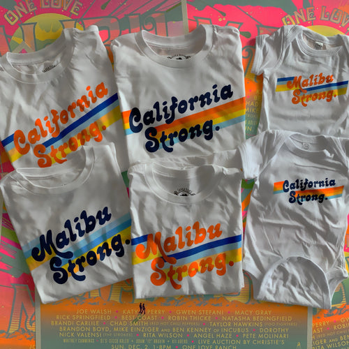 White t-shirt with a rainbow strip across the chest and words stating California strong on it. 