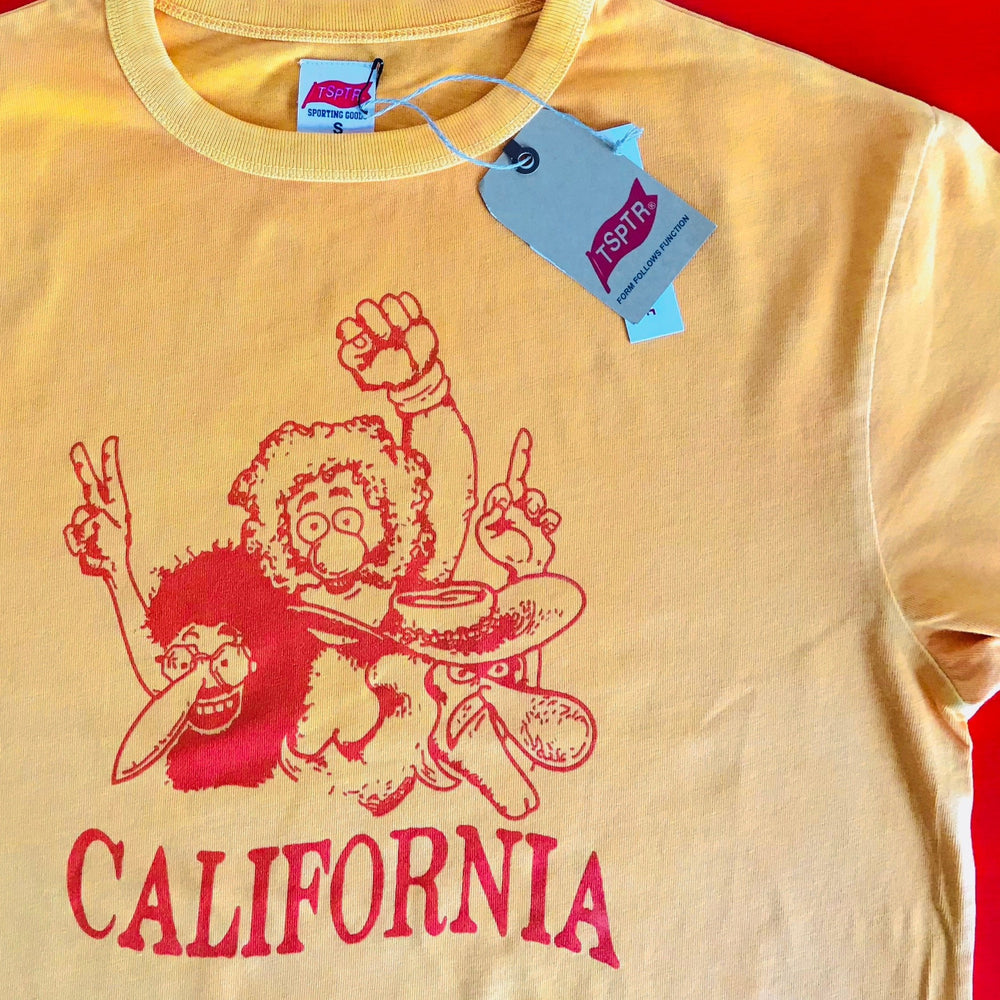 TSPTR Freaks T-shirt.  Yellow shirt with a red design off odd looking people. The word california below them. 