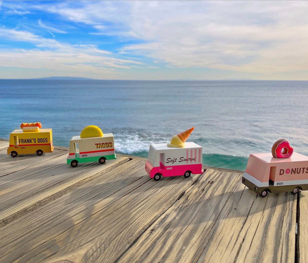 Mini LeToy Vans. One is a Frank's Dogs Truck, a Taco Truck, Soft serve truck, and donut truck. 