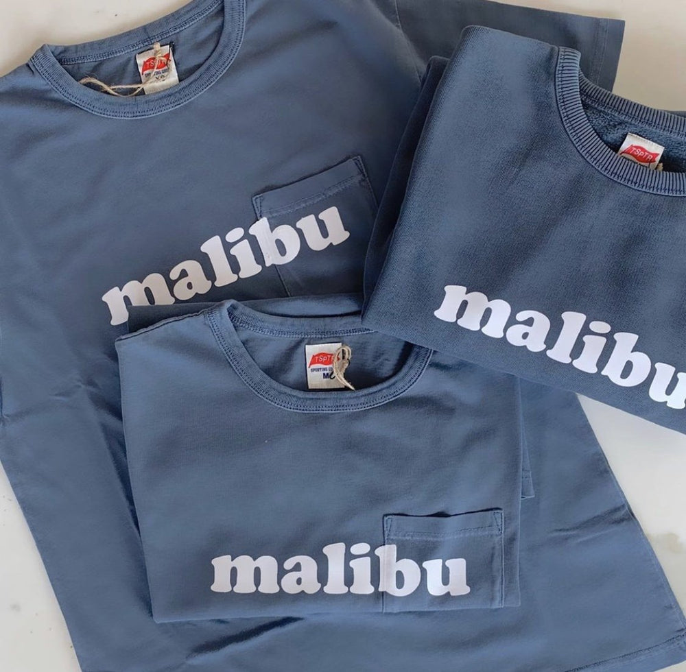 TSPTR Faded Navy Malibu Sweatshirt. blue sweatshirt with the word Malibu across the chest area in white text. 