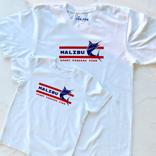 One Gun Malibu Fishing Pier T-shirt. White shirt with a blue and red design. 