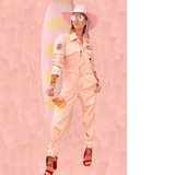 MOMO X One Gun Pink Jumpsuit in pink with multiple patches in the sleeve and the front pocket. 