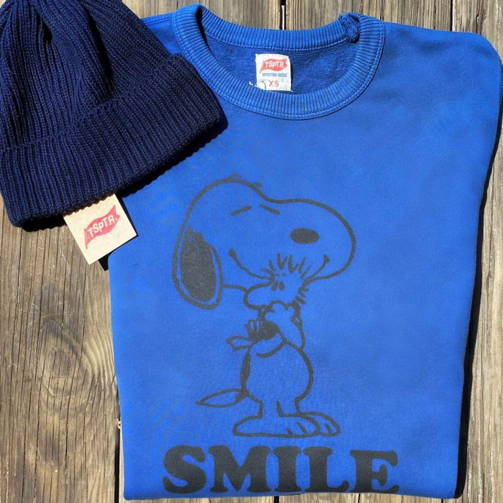 Blue Peanuts Smile Pullover with a design of snoopy hugging woodstock