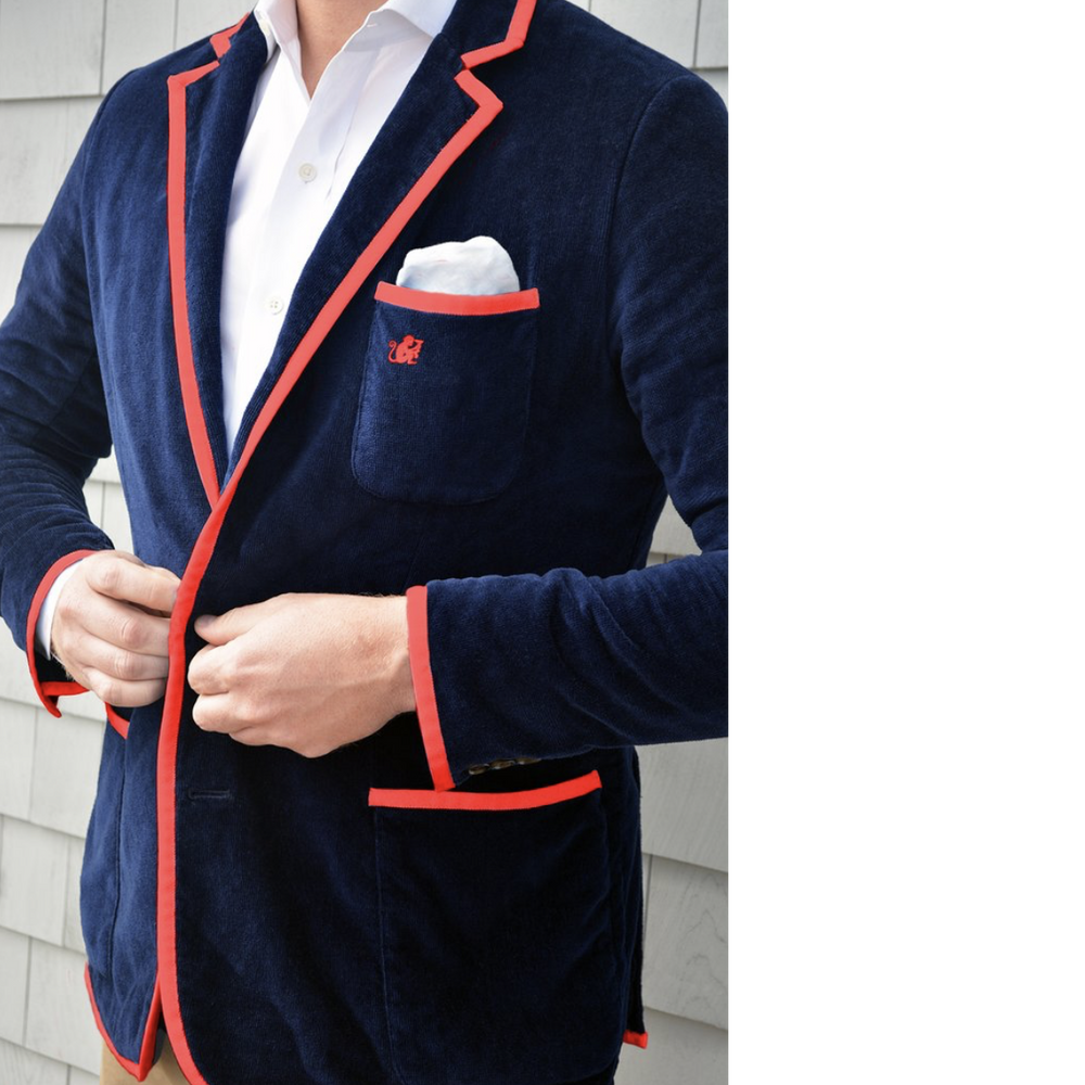 Navy blue with red strip lining Toweling blazer is made from terry velour. Sheared on the outside giving the blazer a super soft velvety finish. The terry cloth is looped on the inside like your standard beach towel, like a robe it'll actually get you dry. 