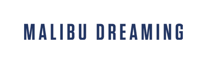 One Gun Malibu Dreaming T-shirt. White shirt with blue text saying Malibu dreaming. 