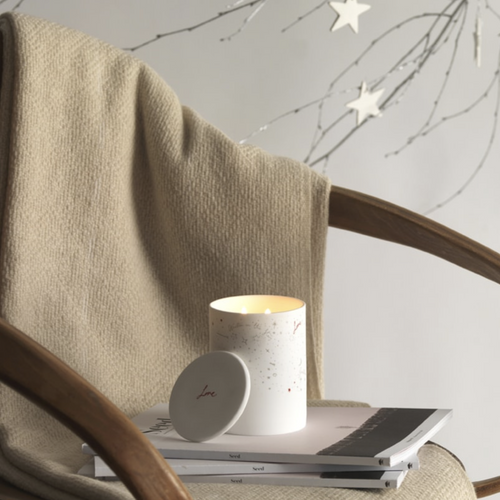 A calming, warm blend of woodsmoke and amber distilled into a natural wax and set into a starry night ceramic vessel.