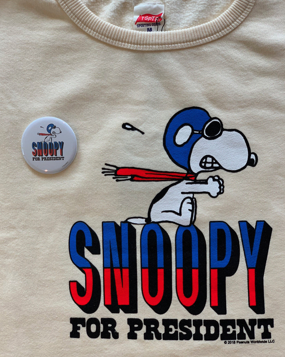 TSPTR Snoopy For President Sweatshirt. White shirt with a red white and blue design of Snoopy For President. 