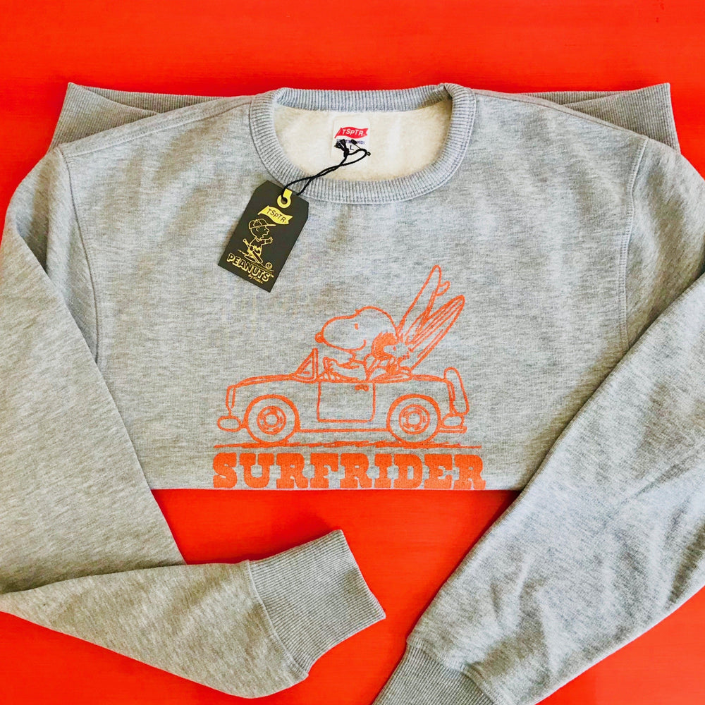 TSPTR Surfrider Pullover Sweatshirt. Gray sweatshirt with an orange design of Snoopy driving a car with Woodstock on top and two surfboards. Below it says Surfrider. 