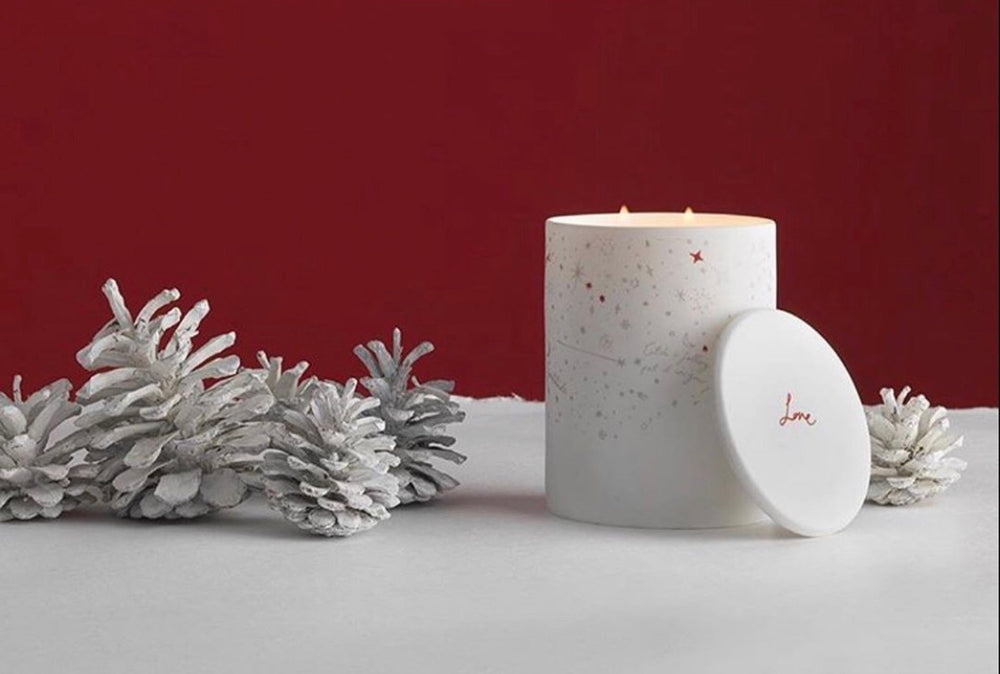 A calming, warm blend of woodsmoke and amber distilled into a natural wax and set into a starry night ceramic vessel.