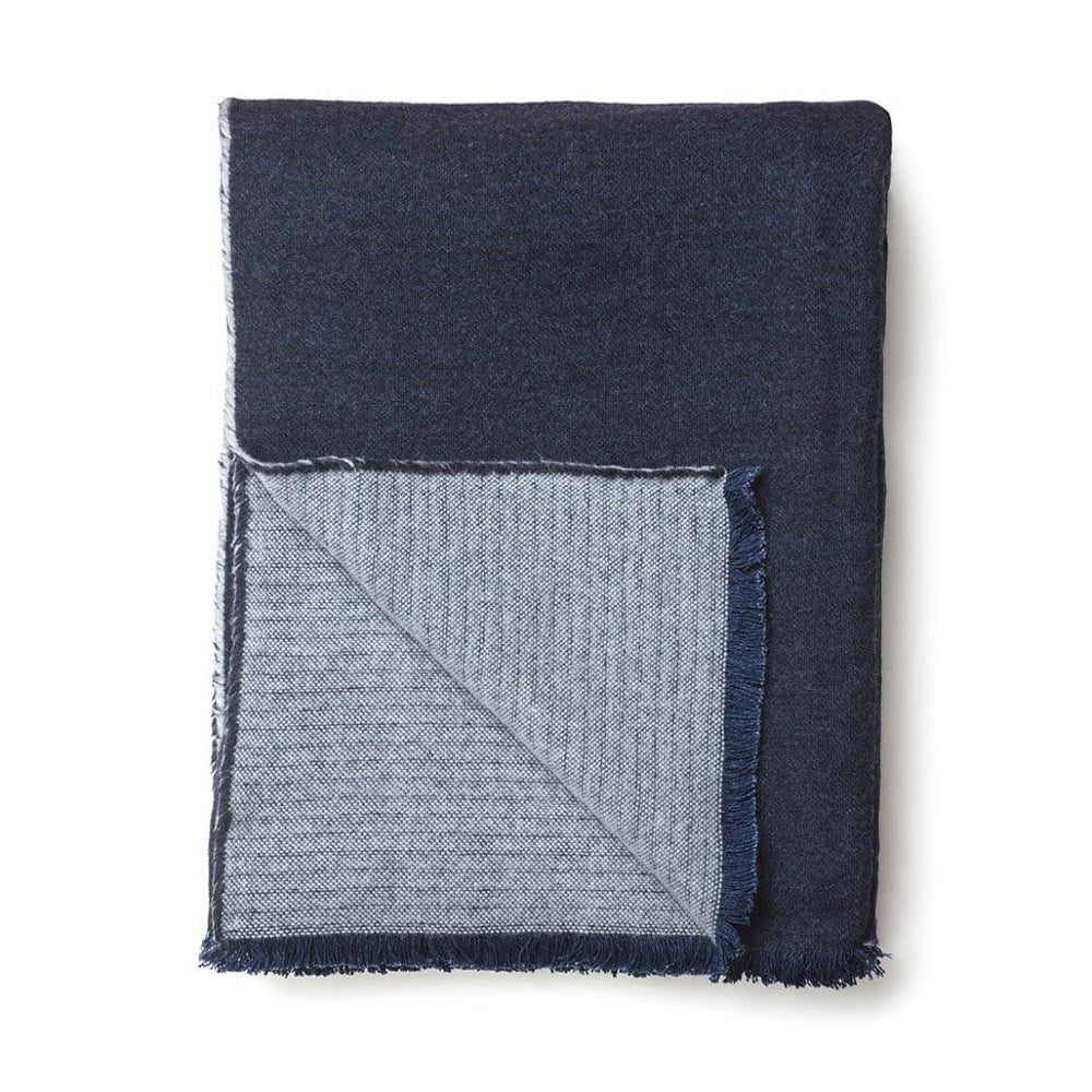 Draylesford indigo blanket. The top is dark navy blue and the flip side is gray. 100% Linen. Made in India.
