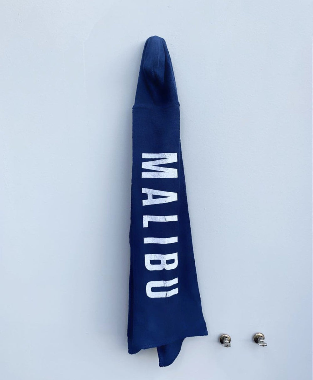 One Gun Ranch Kids Hooded Beach Towels. Blue terry cloth with Malibu printed in white text down the side. 