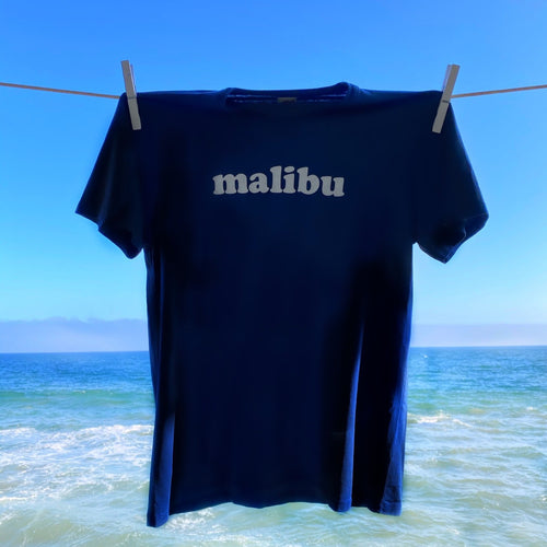 TSPTR Malibu T-Shirt. Blue shirt with the word Malibu on the chest in white text. 