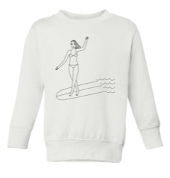 Kids white sweatshirt by Gracias california. There a woman in a bikini on a surfboard doing a cross step. 